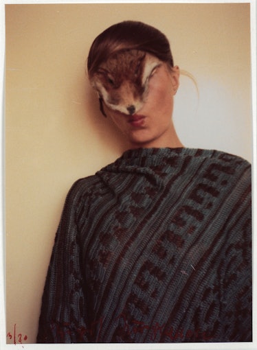 Ohne Titel photo of a woman posing with fox skin over her face