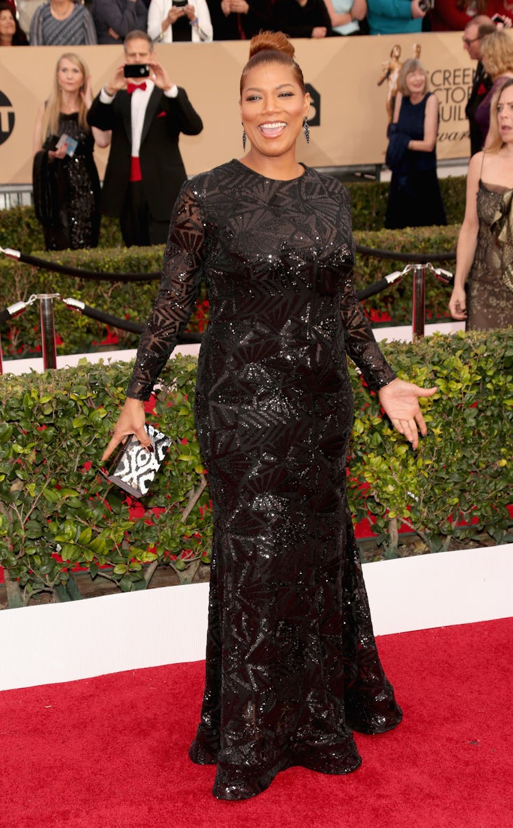 Queen Latifah posing in a black glittery long dress at the 22nd Annual Screen Actors Guild Awards re...