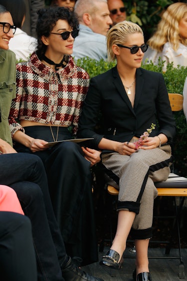 Kristen Stewart sitting next to her ex-girlfriend St. Vincent.