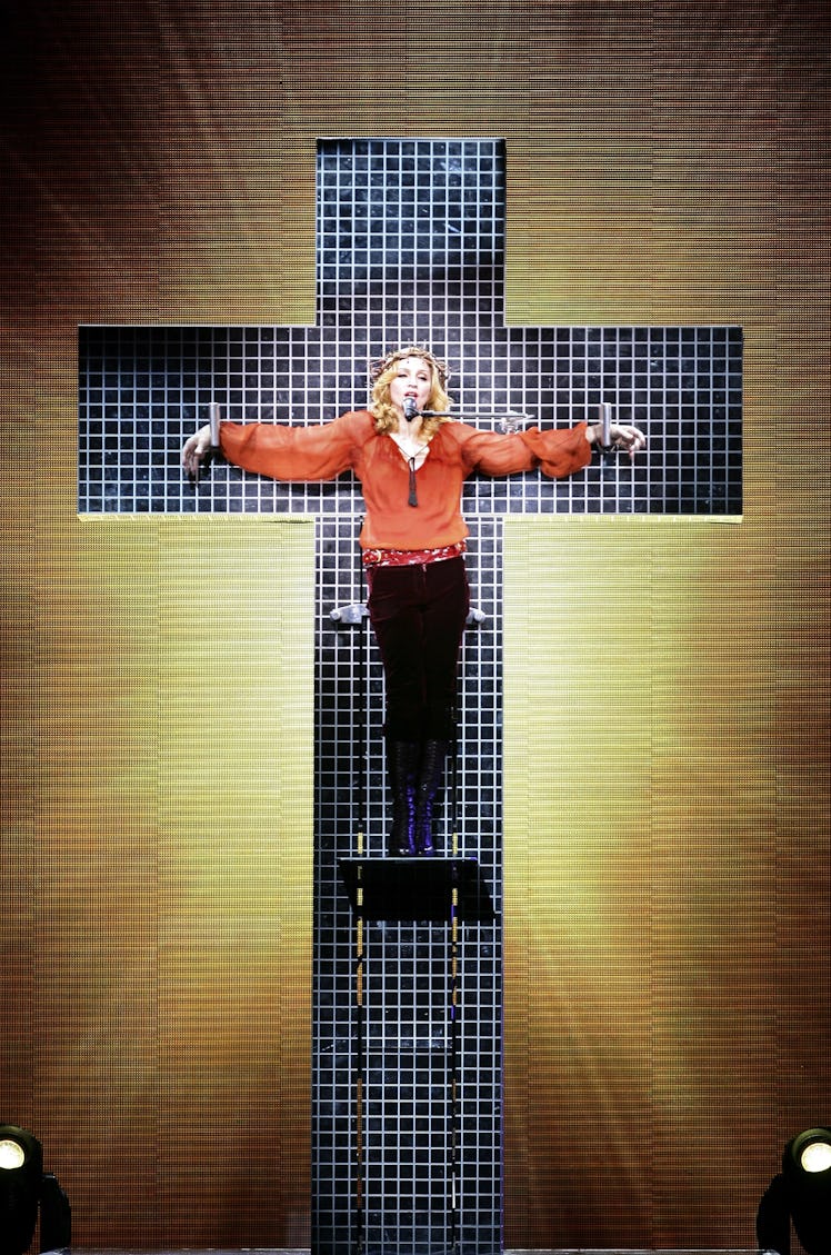 Madonna nailed to a cross. 