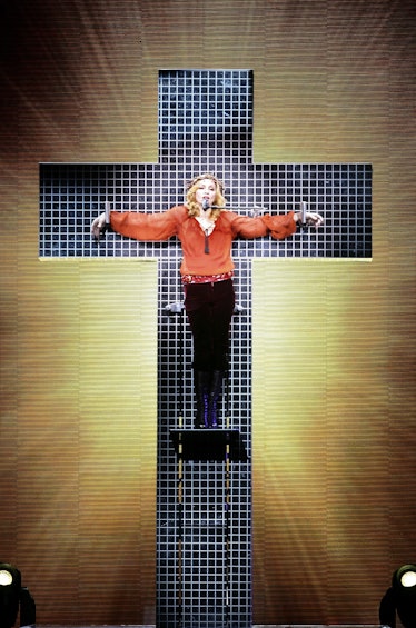 Madonna nailed to a cross. 