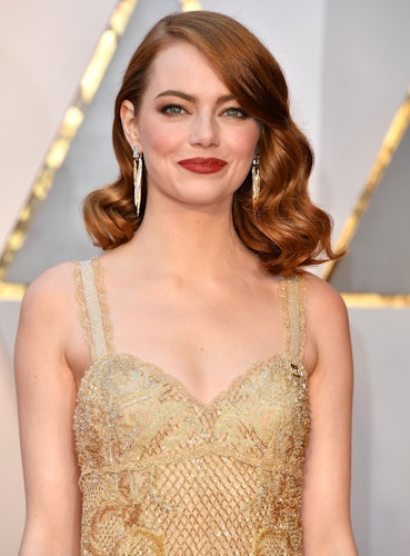 Emma Stone sports heel plasters as she carries Louis Vuitton bag