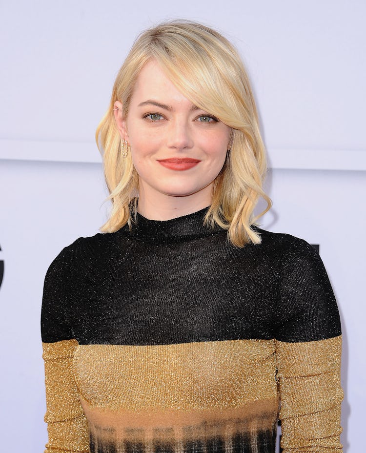 Emma Stone with a blonde wavy hair at the AFI Life Achievement Award Gala.