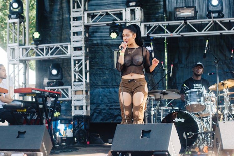 A woman singing on the stage at the Afropunk Festival 