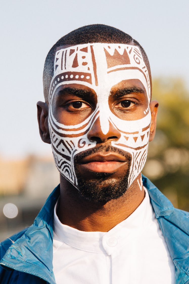 A man with white face paint at the Afropunk Festival 
