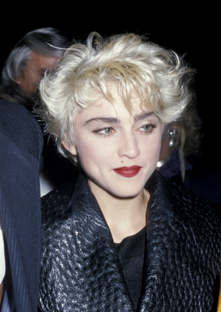 Madonna rocking her iconic feathered platinum blonde Pixie cut in 1986