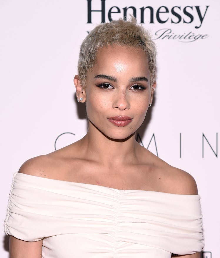Zoe Kravitz wearing a white open-shoulder dress with a Pixie cut at the Premiere of 'Gemini'