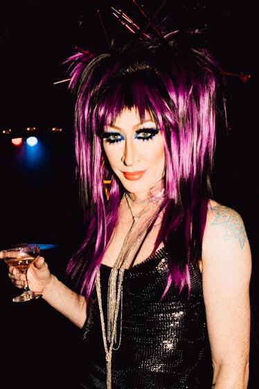 Drag Race contestant Detox in a black dress and purple wig at Marc Jacobs and RuPaul’s Drag Ball