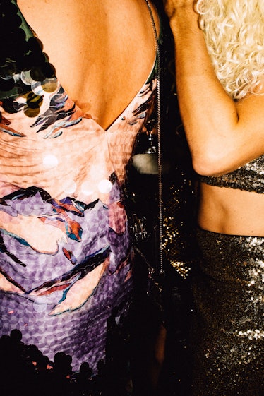 A guest in a pink sequin dress and a guest in a gold sequin top at Marc Jacobs and RuPaul’s Drag Bal...