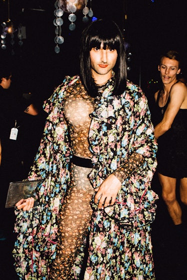 An attendee in a floral jumpsuit and a cape at Marc Jacobs and RuPaul’s Drag Ball