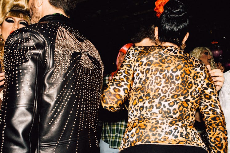 A guest in a black leather jacket and a guest in a leopard print jacket at Marc Jacobs and RuPaul’s ...