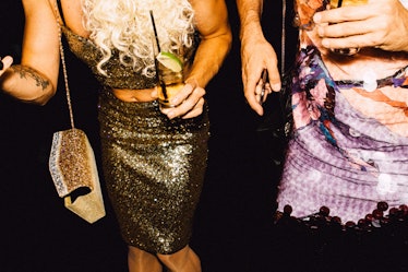 A guest in a gold sequin top and skirt and a guest in a pink sequin dress  at Marc Jacobs and RuPaul...