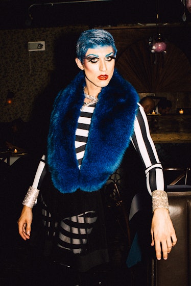 An attendee in a black-white striped top and blue scarf at Marc Jacobs and RuPaul’s Drag Ball