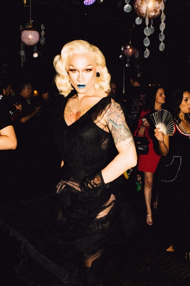 Miss Fame posing in a black lace dress at Marc Jacobs and RuPaul’s Drag Ball