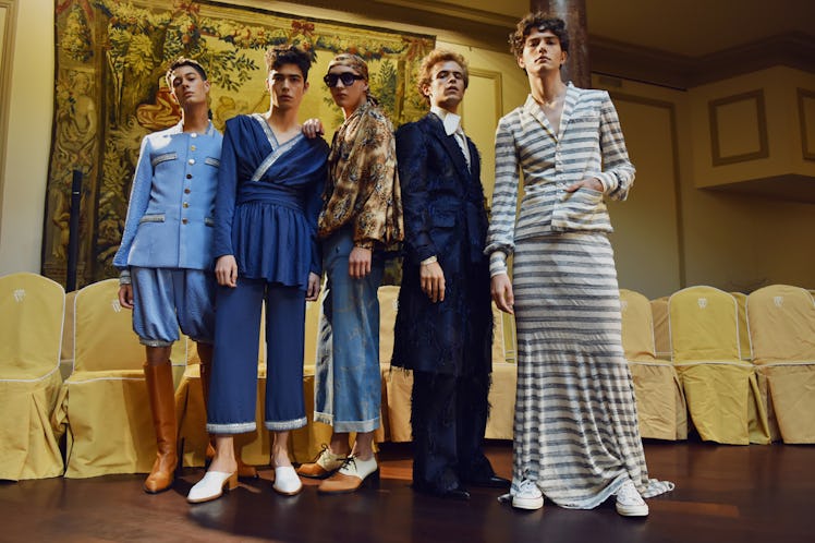 Four models wearing navy and beige outfits backstage at the Palomo Spain SS18 runway