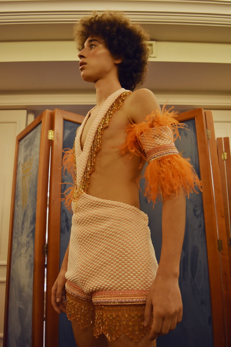 A model wearing a beige-orange feather playsuit at the Palomo Spain SS18 runway