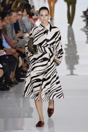 A model walking the runway in a zebra-print dress for Roberto Cavalli’s show during Milan Fashion We...