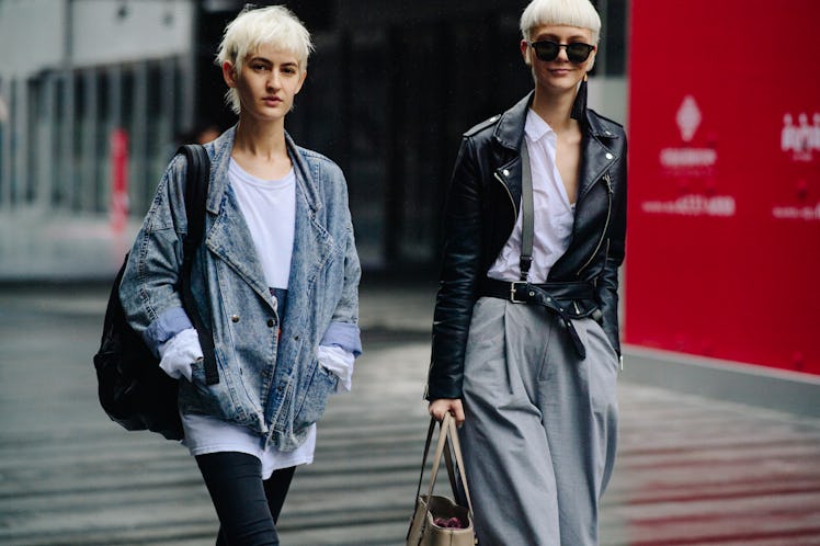 Two blonde short-haired women walking together