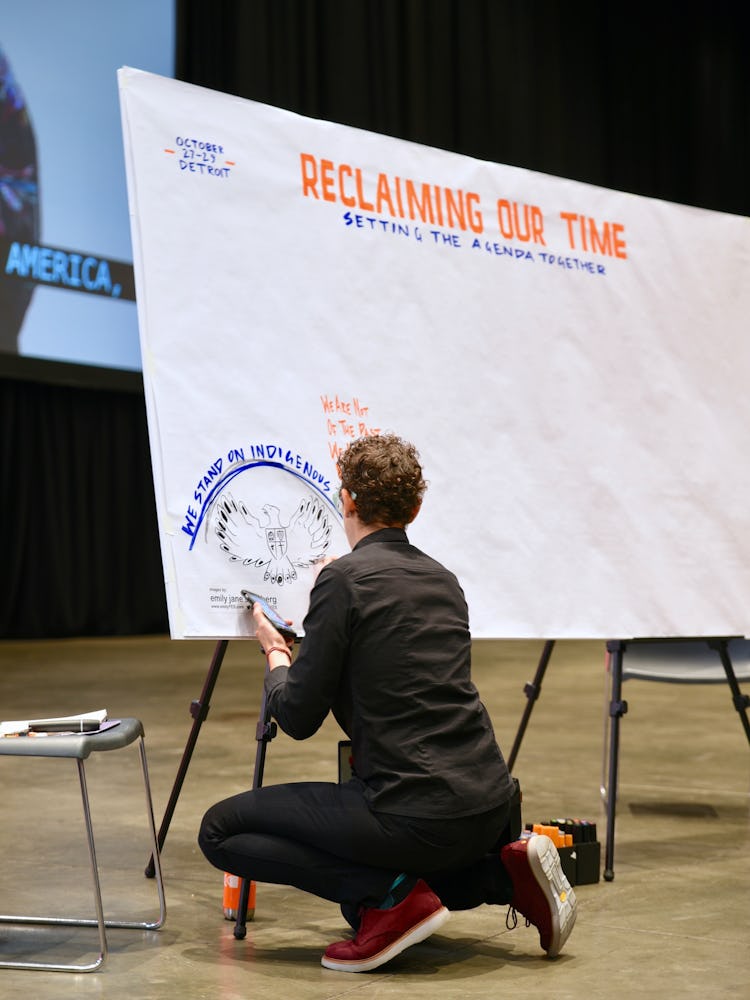 Activist writing on a board at the 2017 Women’s Convention