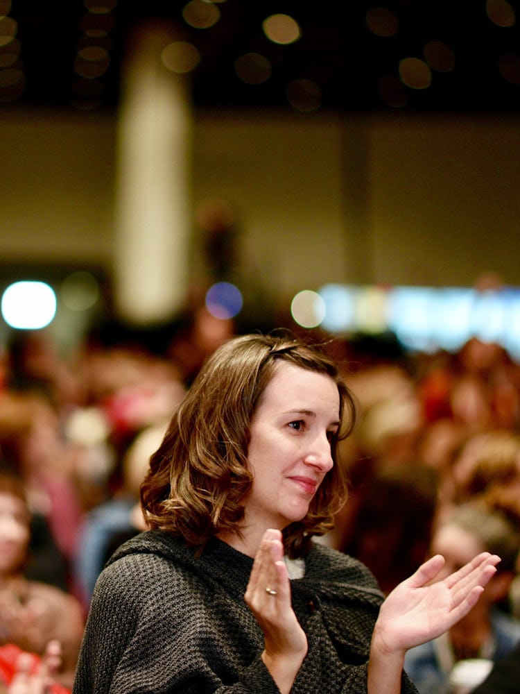 A woman applauding at the 2017 Women’s Convention, hosted in Detroit, Mich.