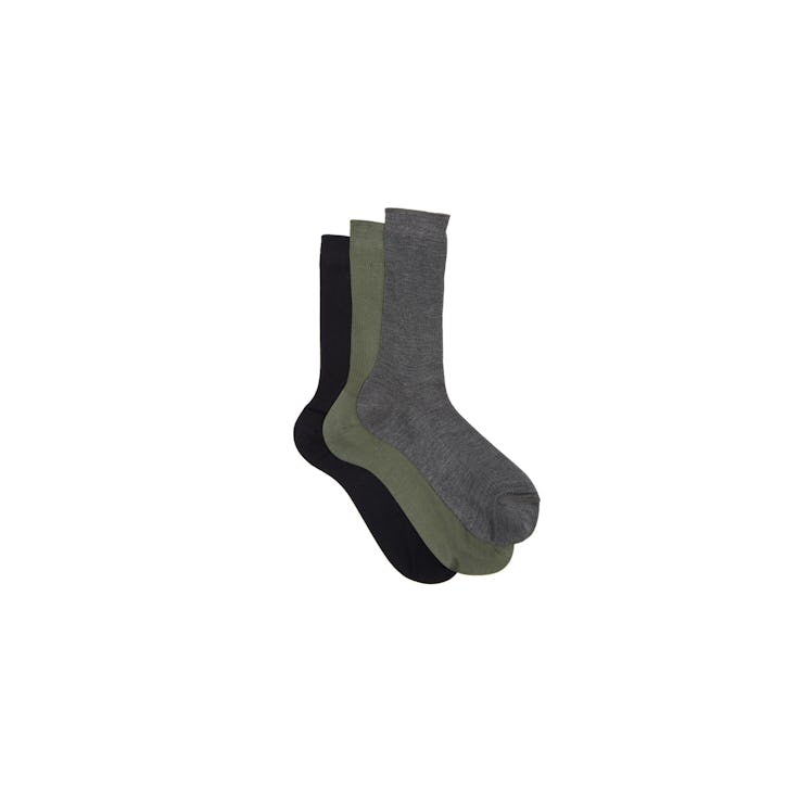 Raey socks in shades of khaki green, grey mélange, and dark navy