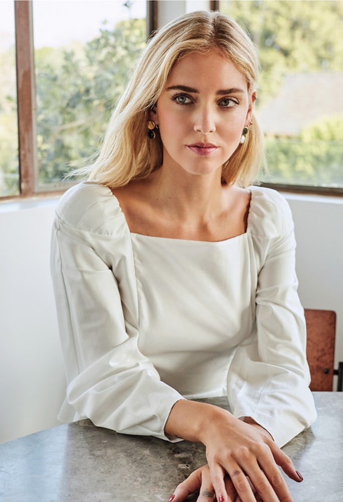 Chiara Ferragni in a white Massimo Dutti shirt and Faris earrings