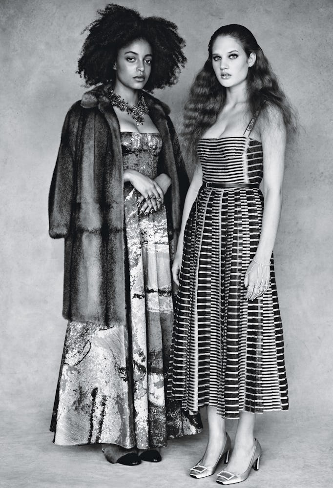 Two models in Dior Belted dresses standing and posing in black and white