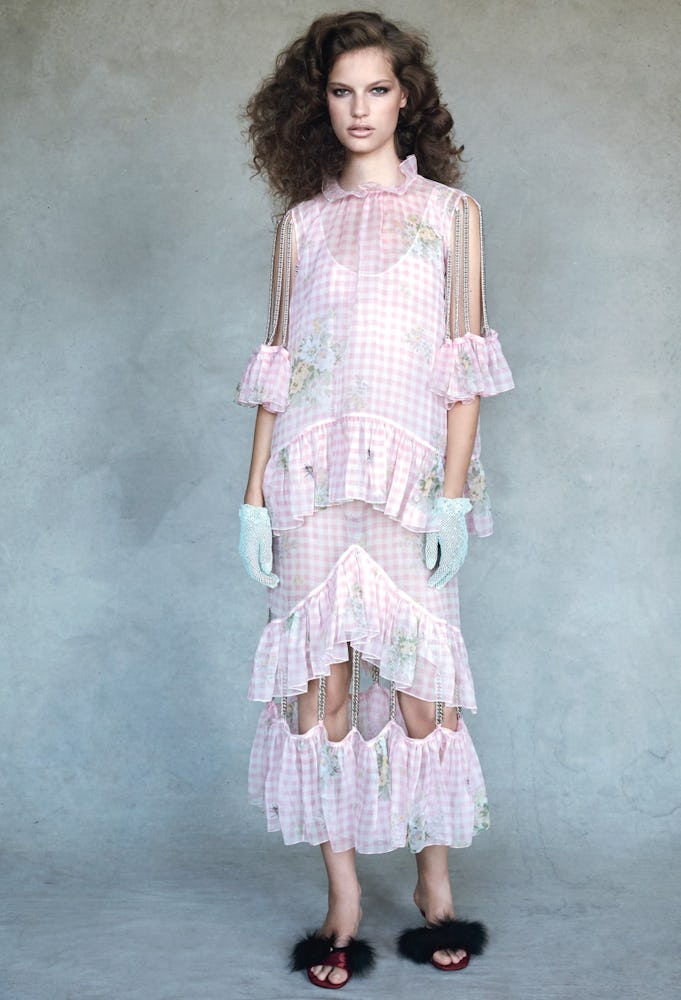 A model in a pink and white checkered Christopher Kane dress