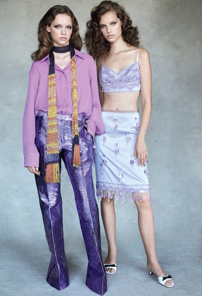 A model in a purple Hermes shirt and purple Gucci pants; a model in a lilac Marc Jacobs top and skir...