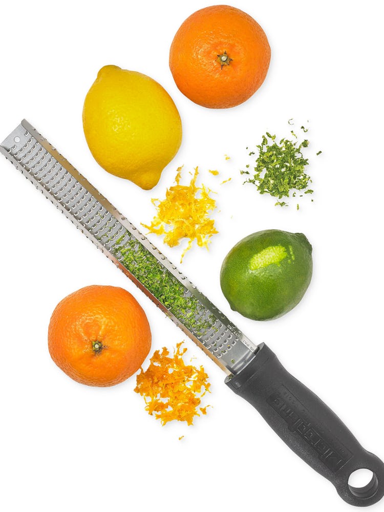 Martha Stewart Collection zester, two halves of an orange, a lemon and a lime