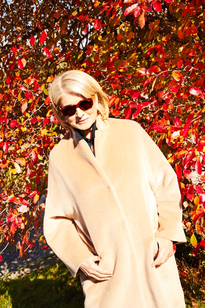 Martha Stewart in a beige Brunello Cucinelli coat and brown sunglasses