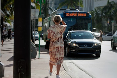 A woman in front of Art Basel Miami international art fair