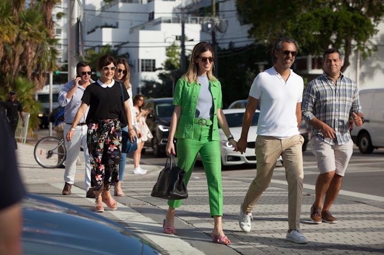 Visitors wearing bright colors arriving at Art Basel Miami international art fair