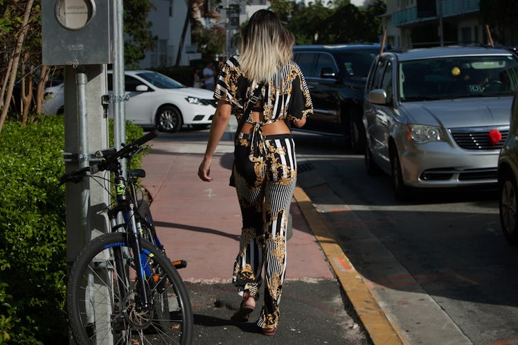 A woman wearing a bold printed co-ord set arriving at Art Basel Miami international art fair