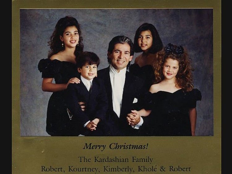 A Christmas card with Robert Kardashian with his kids - Kim, Khloe, Kourtney and Rob, with the text ...