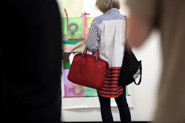 A woman wearing a colorful shirt at Art Basel Miami international art fair