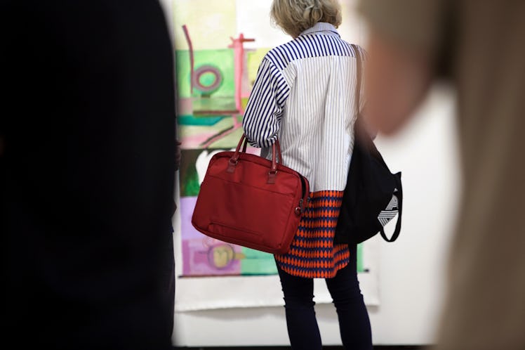 A woman wearing a colorful shirt at Art Basel Miami international art fair
