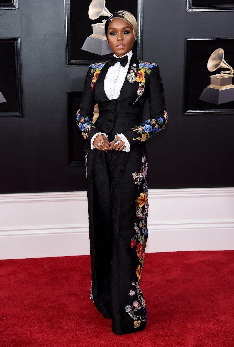 Janelle Monae in a black suit with floral elements at the Grammys 2018