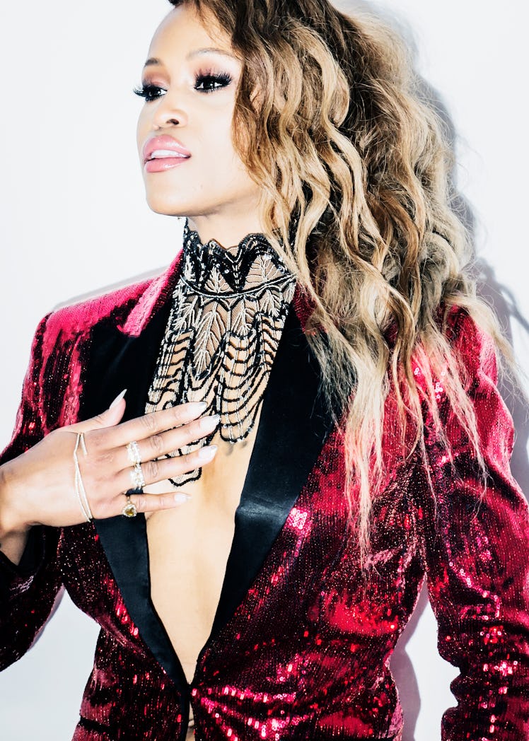 Eve in a red-black sequin blazer and a black beaded statement necklace at the 2018 Grammy Award