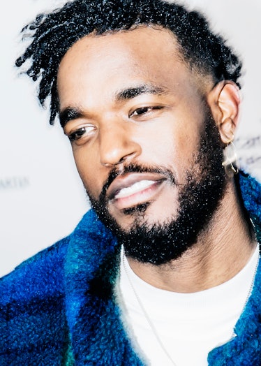 Luke James in a white top and blue jacket at the 2018 Grammy Award After Party