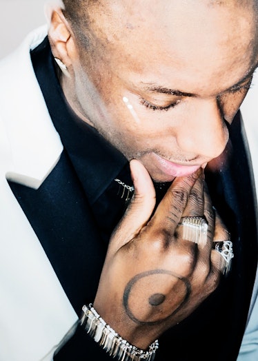 Young Paris in a white-black suit and silver rings at the 2018 Grammy Award After Party