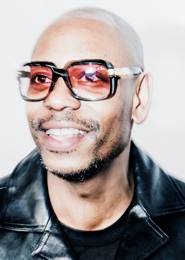 Dave Chapelle in a black jacket and orange sunglasses at the 2018 Grammy Award After Party