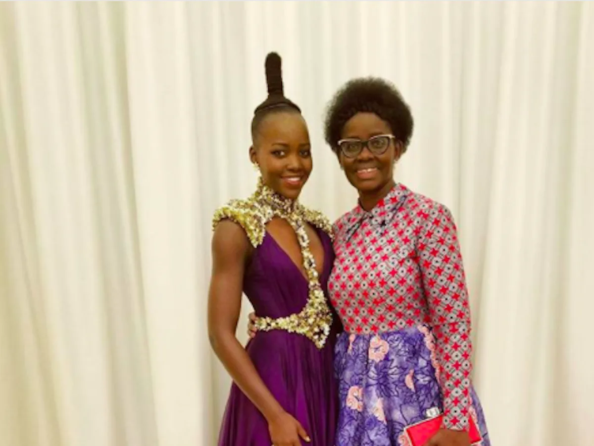 lupita nyong'o purple dress Lupita Nyong'o wears a pretty purple dress for NAACP's Act-So award ceremony where she surprised 40 students with education scholarships # LupitaNyongo Photos: Getty