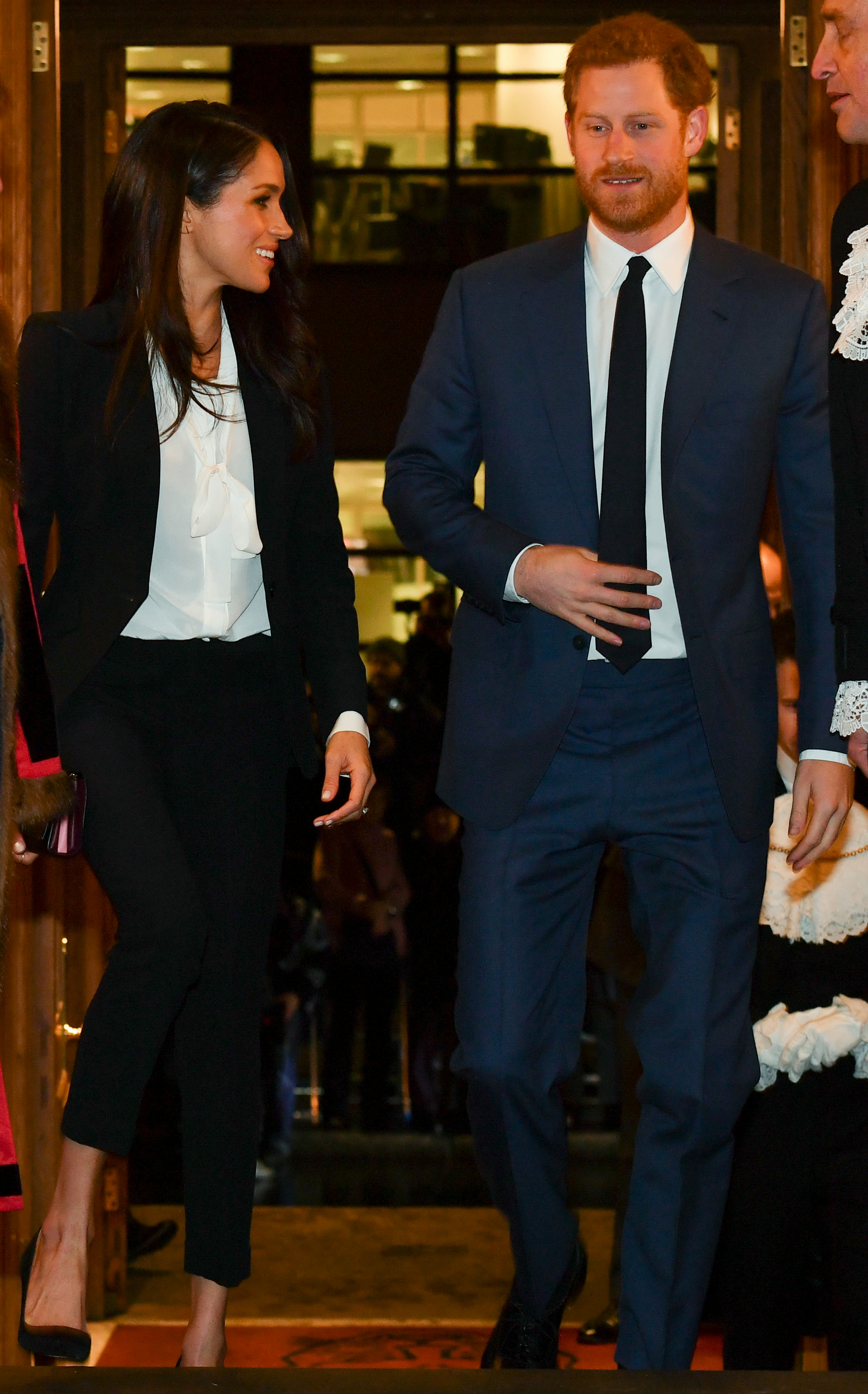 Meghan Markle and Prince Harry Show Up in Suits For First Red Carpet  Appearance