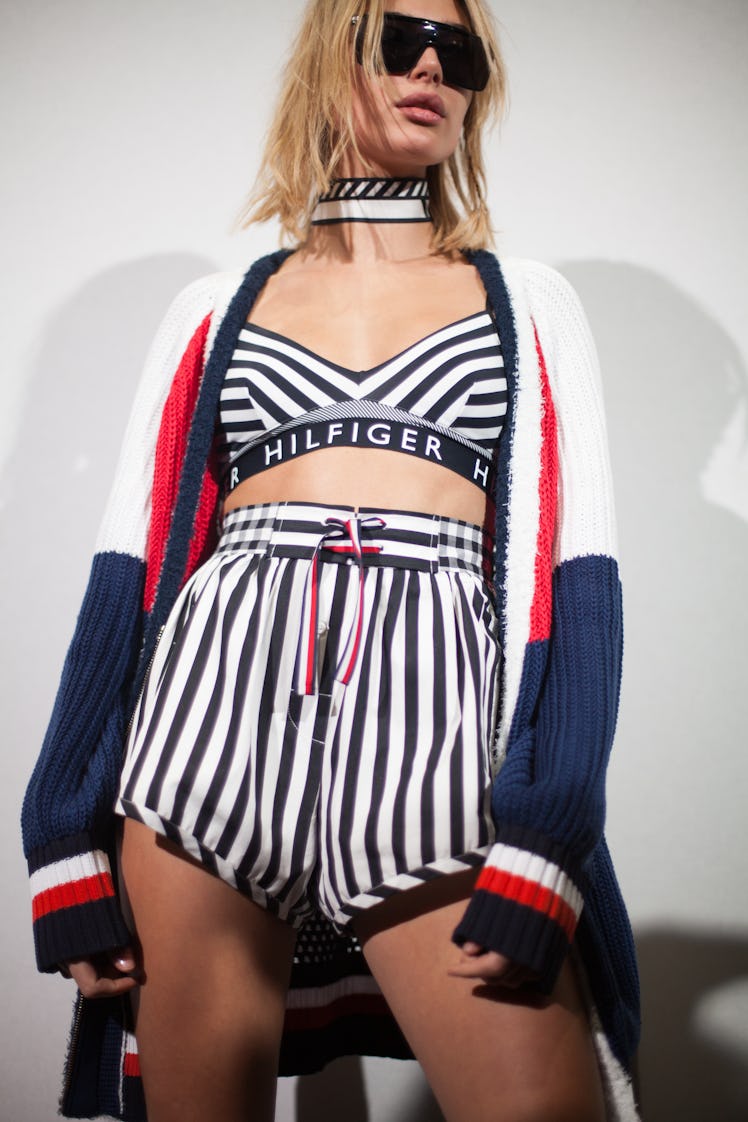 A model posing in Tommy Hilfiger Fall 2018 look during Milan Fashion Week