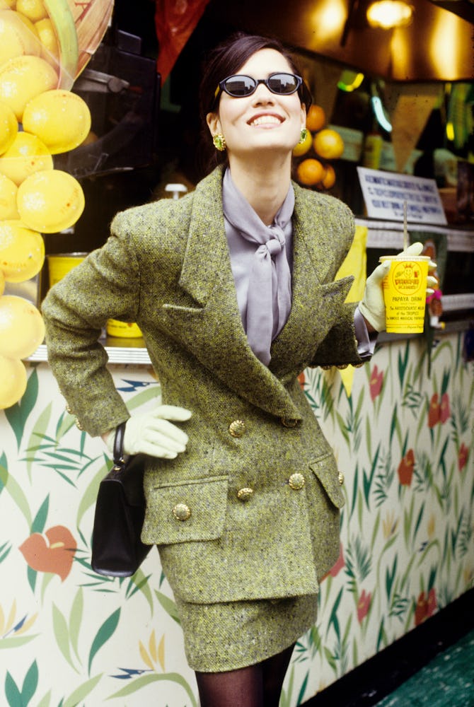 A woman wearing an olive green blazer and skirt combination on St. Patrick’s Day