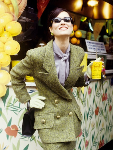 A woman wearing an olive green blazer and skirt combination on St. Patrick’s Day