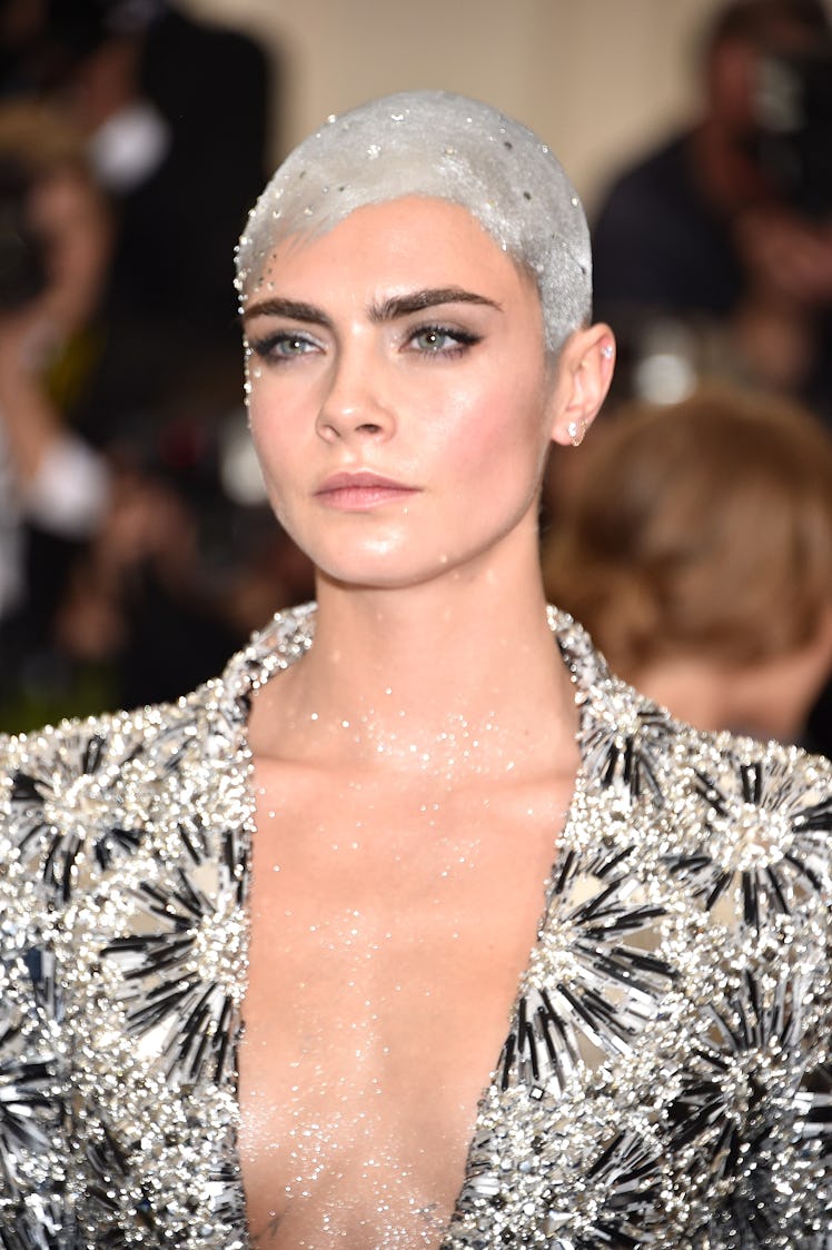 Cara Delevingne with a silver head at the 2017 Met Gala