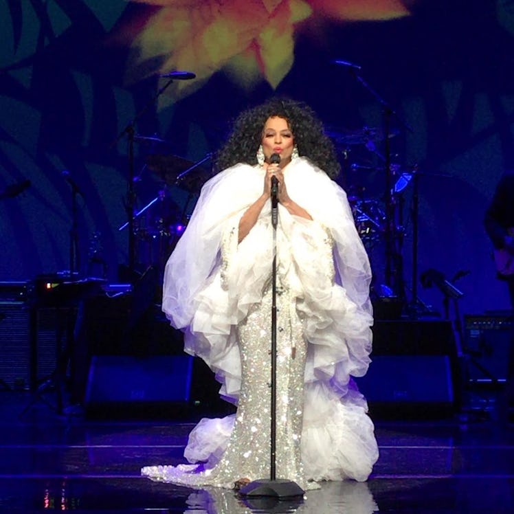 Diana Ross, one of the savviest celebrity moms on social media, in a white gown performing