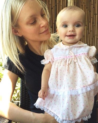 Jessica Stam, mom supermodel, holding her daughter.